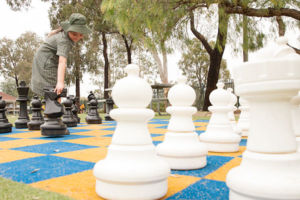 Students playing giant chess during lunchtime at St Francis Xavier's Catholic Primary School Lurnea