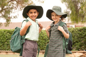 Two St Francis Xavier's Catholic Primary School Lurnea students smiling to camera